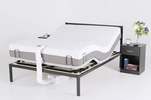 A Queen bedframe with a PowerLayer installed and a bare mattress on top, and one BedJet unit is installed at the foot of the bed with the footside of the PowerLayer raised