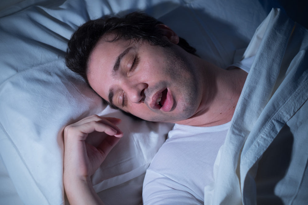 a man sleeping in a bed